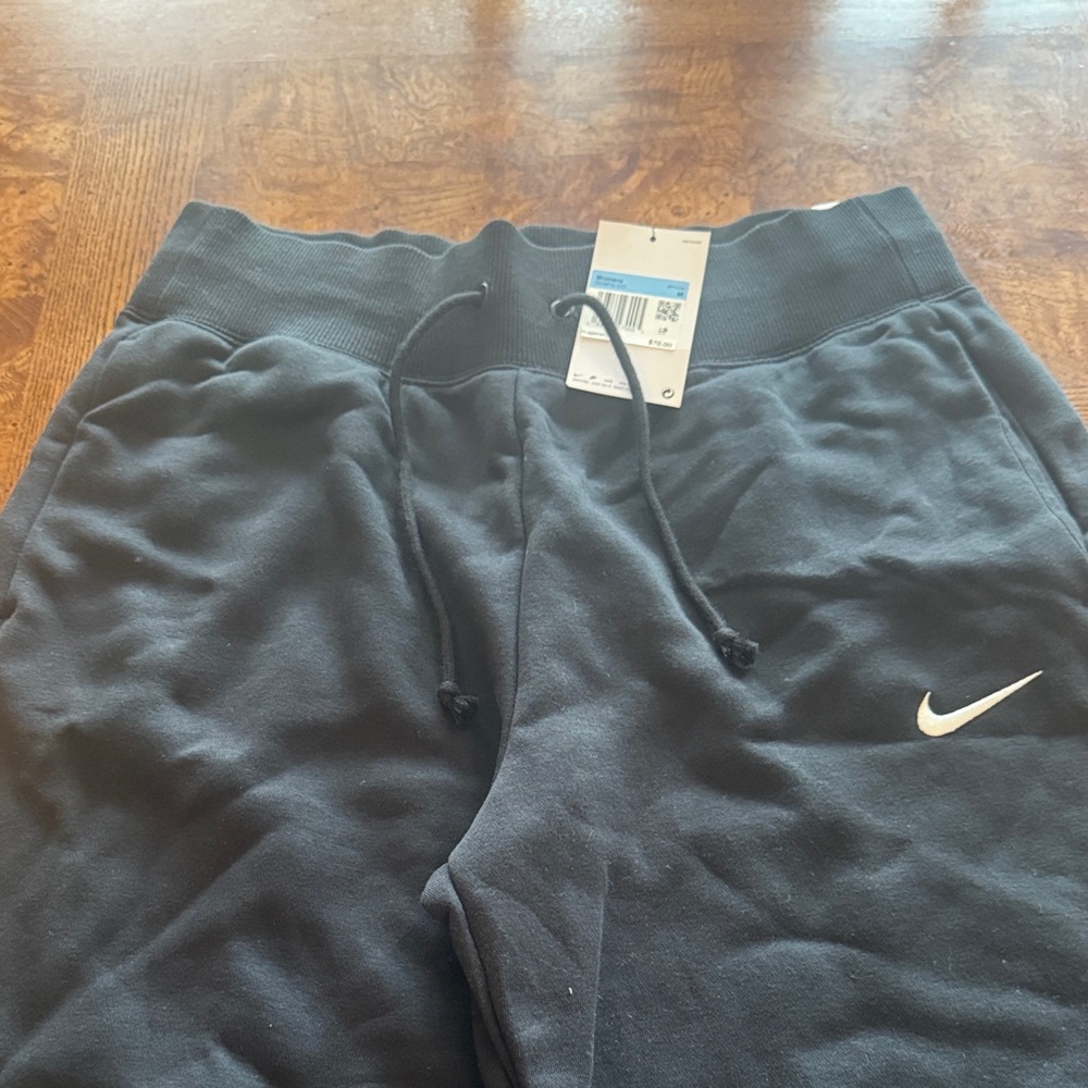 Nike womens Black wide leg Sweatpants with White Swoosh